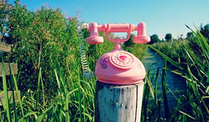 Preview wallpaper telephone, toy, grass, river, trees