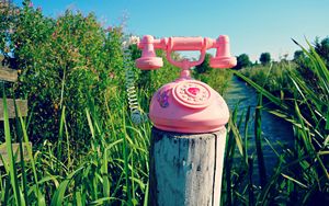Preview wallpaper telephone, toy, grass, river, trees