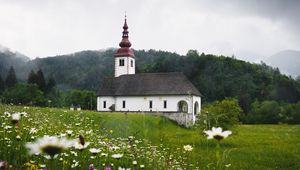 Preview wallpaper temple, field, flowers, grass, slovenia