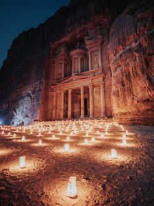 Preview wallpaper temple, rock, candles, architecture