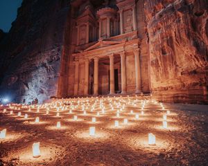 Preview wallpaper temple, rock, candles, architecture