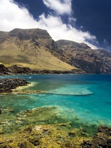 Preview wallpaper tenerif, spain, mountains, gulf, stones, fisherman, sky, clouds, clearly