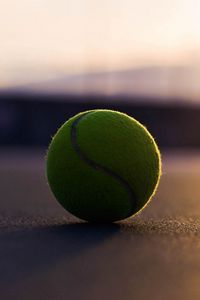 Preview wallpaper tennis ball, asphalt, shadow, sport, bending