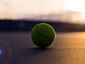 Preview wallpaper tennis ball, asphalt, shadow, sport, bending