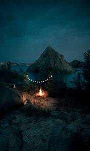 Preview wallpaper tent, camping, campfire, garland, rocks