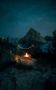 Preview wallpaper tent, camping, campfire, garland, rocks