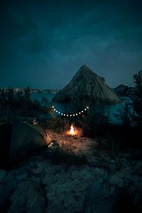 Preview wallpaper tent, camping, campfire, garland, rocks