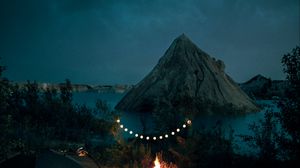 Preview wallpaper tent, camping, campfire, garland, rocks