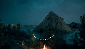 Preview wallpaper tent, camping, campfire, garland, rocks