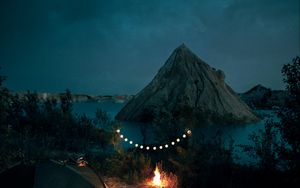 Preview wallpaper tent, camping, campfire, garland, rocks