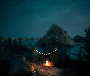 Preview wallpaper tent, camping, campfire, garland, rocks