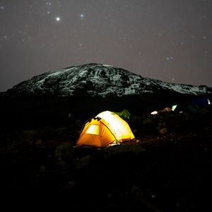 Preview wallpaper tent, glow, mountain, starry sky, dark