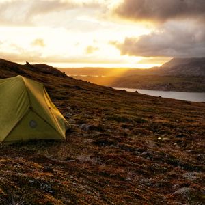 Preview wallpaper tent, hill, river, clouds, nature