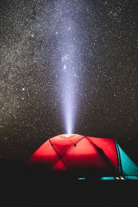 Preview wallpaper tent, night, starry sky, light, beam, camping