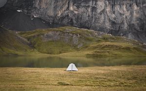Preview wallpaper tent, rocks, mountains, fog, grass