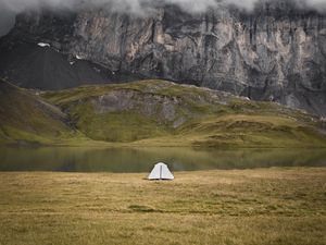 Preview wallpaper tent, rocks, mountains, fog, grass