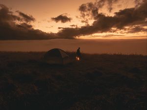 Preview wallpaper tent, silhouette, campfire, dark, twilight