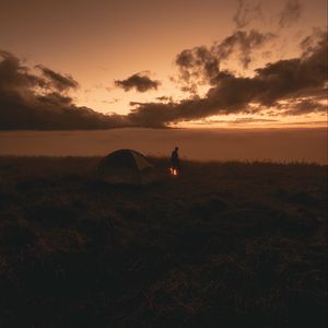 Preview wallpaper tent, silhouette, campfire, dark, twilight