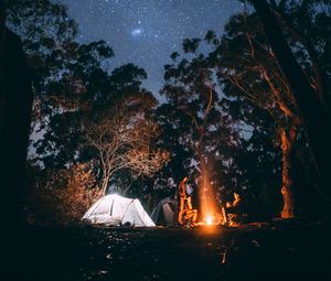 Preview wallpaper tent, starry sky, bonfire, camping, recreation, trees, forest