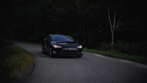 Preview wallpaper tesla, car, asphalt, dark, forest