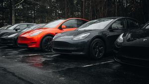 Preview wallpaper tesla, car, black, wheel, drops, rain