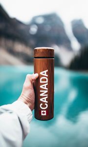 Preview wallpaper thermos, hand, inscription, brown, wooden