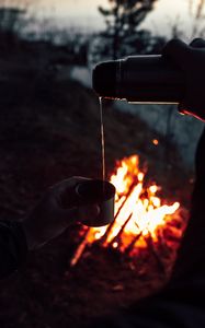 Preview wallpaper thermos, tea, bonfire, dark