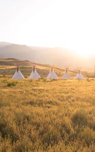 Preview wallpaper tipi, grass, sunshine, mountains