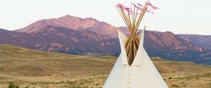 Preview wallpaper tipi, grass, valley, mountains