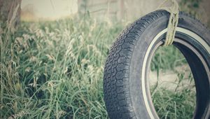 Preview wallpaper tire, rope, grass
