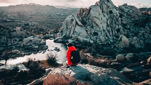 Preview wallpaper tourist, girl, travel, stones, rocks