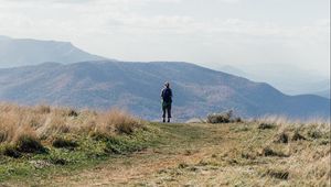 Preview wallpaper tourist, mountains, fog, path, landscape