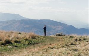 Preview wallpaper tourist, mountains, fog, path, landscape