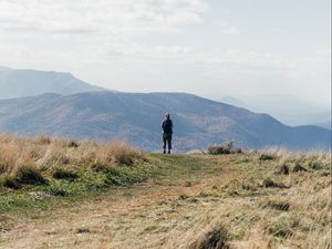 Preview wallpaper tourist, mountains, fog, path, landscape