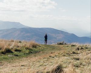 Preview wallpaper tourist, mountains, fog, path, landscape