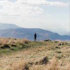 Preview wallpaper tourist, mountains, fog, path, landscape