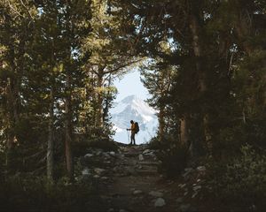 Preview wallpaper tourist, silhouette, forest, trees, mountain, nature