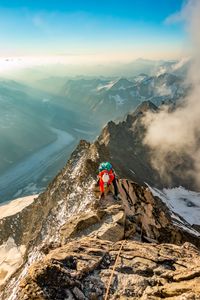 Preview wallpaper tourist, traveler, climber, mountains, rocks, snow