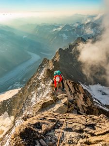 Preview wallpaper tourist, traveler, climber, mountains, rocks, snow