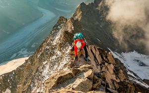 Preview wallpaper tourist, traveler, climber, mountains, rocks, snow