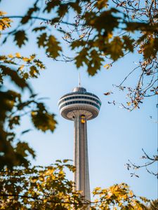 Preview wallpaper tower, building, architecture, branches, trees