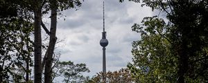 Preview wallpaper tower, building, architecture, trees, branches