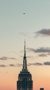 Preview wallpaper tower, building, architecture, sky, clouds, helicopter