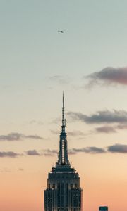 Preview wallpaper tower, building, architecture, sky, clouds, helicopter