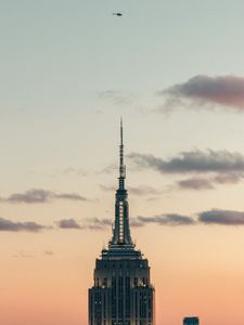 Preview wallpaper tower, building, architecture, sky, clouds, helicopter