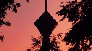 Preview wallpaper tower, building, dark, branches, dusk