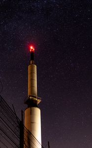 Preview wallpaper tower, building, dark, night, starry sky