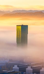 Preview wallpaper tower, building, fog, mountains, valley