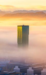 Preview wallpaper tower, building, fog, mountains, valley