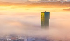 Preview wallpaper tower, building, fog, mountains, valley